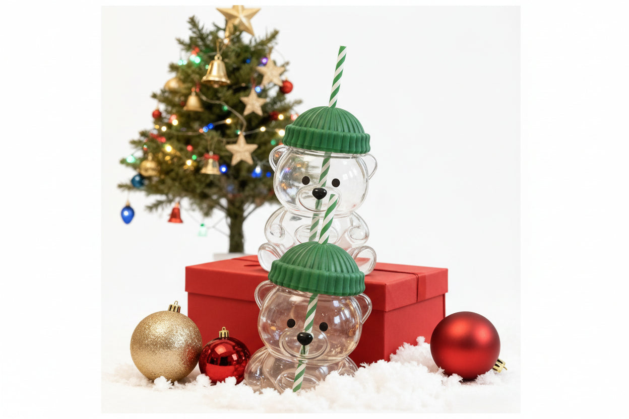 Cute bear glass cup with straw - close-up view of adorable bear design